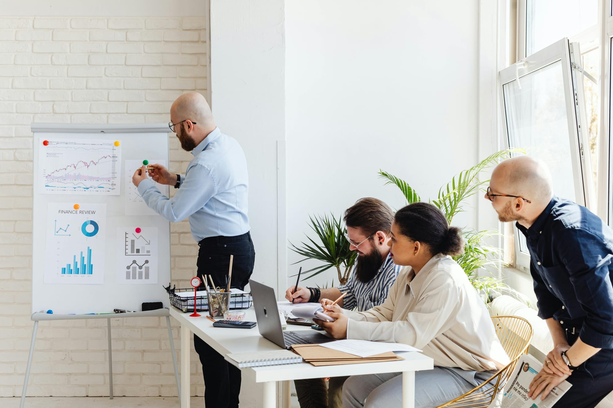 Team members discussing data reports in an office setting